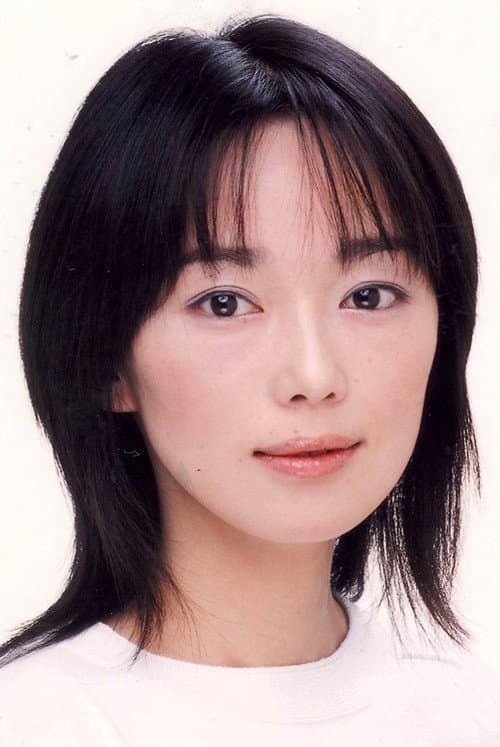 Riona Hazuki as Woman in Red in Retribution