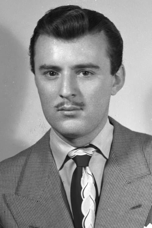 Manolo FΓ‘bregas as Colonel Beltran in Two Mules for Sister Sara