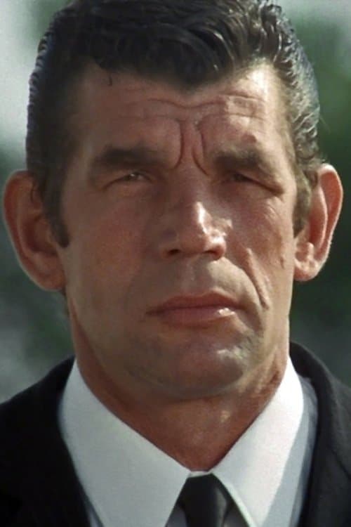 Michel Constantin as Xavier Saratov, Georgia's brother and Roberto's friend in The Pariah