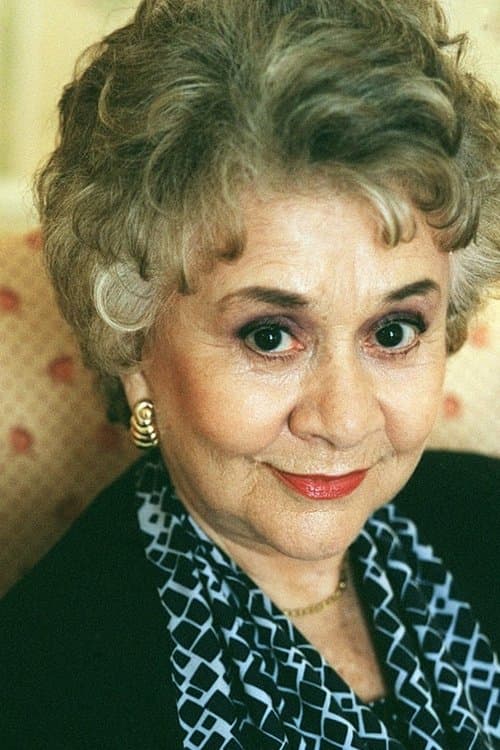 Joan Plowright as Mrs. Virginia Arness in Bringing Down the House